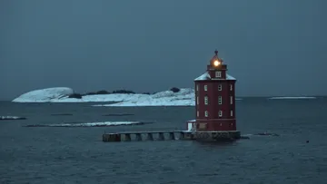 MS Lofoten passes  Kjeungskjær lighthouse