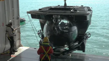 Lowering a U-Boat Workx submersibe from Seabourn Venture 