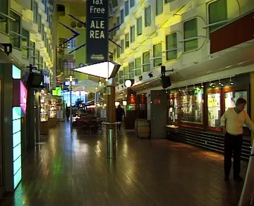 The enclosed promenade deck of Silja Symphony during daytime